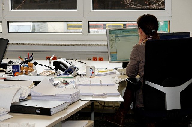 secretary sitting at desk
